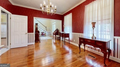 Imagine mornings on your spacious covered front porch or on Okefenokee Country Club in Georgia - for sale on GolfHomes.com, golf home, golf lot