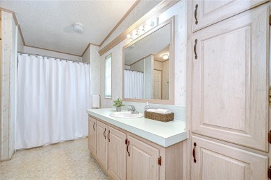 Immaculately maintained Palm Harbor home in picturesque Betmar on Betmar Acres Golf Club in Florida - for sale on GolfHomes.com, golf home, golf lot