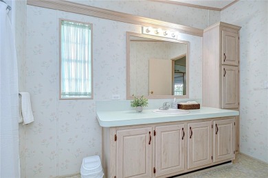 Immaculately maintained Palm Harbor home in picturesque Betmar on Betmar Acres Golf Club in Florida - for sale on GolfHomes.com, golf home, golf lot