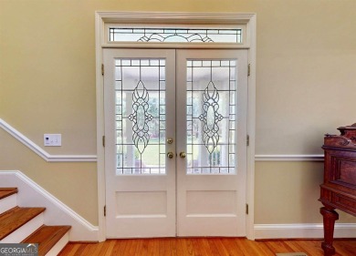 Imagine mornings on your spacious covered front porch or on Okefenokee Country Club in Georgia - for sale on GolfHomes.com, golf home, golf lot