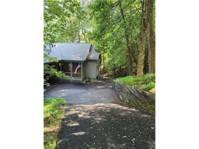 Nestled near the end of a serene Cul de sac, this beautiful on Big Canoe Golf Club - Cherokee in Georgia - for sale on GolfHomes.com, golf home, golf lot