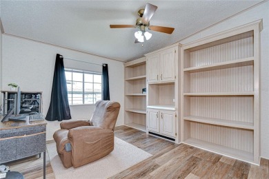Immaculately maintained Palm Harbor home in picturesque Betmar on Betmar Acres Golf Club in Florida - for sale on GolfHomes.com, golf home, golf lot