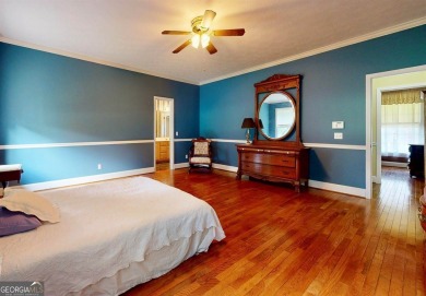 Imagine mornings on your spacious covered front porch or on Okefenokee Country Club in Georgia - for sale on GolfHomes.com, golf home, golf lot