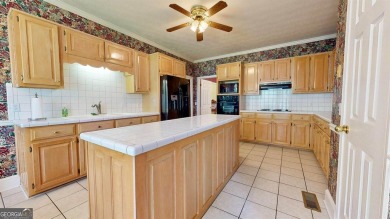 Imagine mornings on your spacious covered front porch or on Okefenokee Country Club in Georgia - for sale on GolfHomes.com, golf home, golf lot