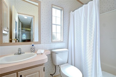 Immaculately maintained Palm Harbor home in picturesque Betmar on Betmar Acres Golf Club in Florida - for sale on GolfHomes.com, golf home, golf lot