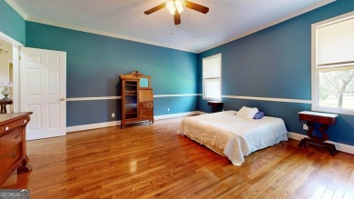 Imagine mornings on your spacious covered front porch or on Okefenokee Country Club in Georgia - for sale on GolfHomes.com, golf home, golf lot