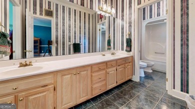Imagine mornings on your spacious covered front porch or on Okefenokee Country Club in Georgia - for sale on GolfHomes.com, golf home, golf lot