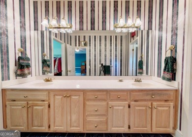 Imagine mornings on your spacious covered front porch or on Okefenokee Country Club in Georgia - for sale on GolfHomes.com, golf home, golf lot