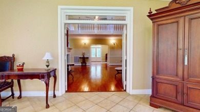 Imagine mornings on your spacious covered front porch or on Okefenokee Country Club in Georgia - for sale on GolfHomes.com, golf home, golf lot