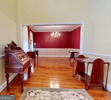 Imagine mornings on your spacious covered front porch or on Okefenokee Country Club in Georgia - for sale on GolfHomes.com, golf home, golf lot