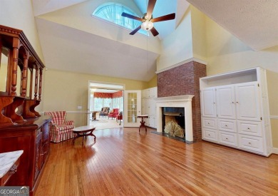 Imagine mornings on your spacious covered front porch or on Okefenokee Country Club in Georgia - for sale on GolfHomes.com, golf home, golf lot