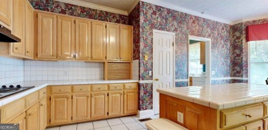 Imagine mornings on your spacious covered front porch or on Okefenokee Country Club in Georgia - for sale on GolfHomes.com, golf home, golf lot