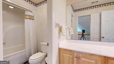 Imagine mornings on your spacious covered front porch or on Okefenokee Country Club in Georgia - for sale on GolfHomes.com, golf home, golf lot