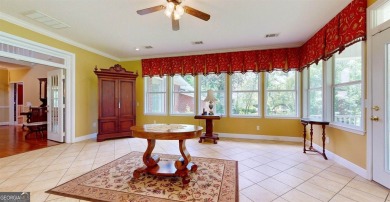 Imagine mornings on your spacious covered front porch or on Okefenokee Country Club in Georgia - for sale on GolfHomes.com, golf home, golf lot