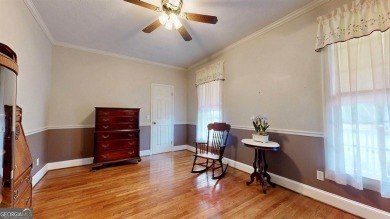 Imagine mornings on your spacious covered front porch or on Okefenokee Country Club in Georgia - for sale on GolfHomes.com, golf home, golf lot
