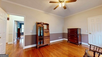 Imagine mornings on your spacious covered front porch or on Okefenokee Country Club in Georgia - for sale on GolfHomes.com, golf home, golf lot
