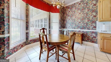 Imagine mornings on your spacious covered front porch or on Okefenokee Country Club in Georgia - for sale on GolfHomes.com, golf home, golf lot