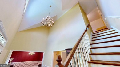 Imagine mornings on your spacious covered front porch or on Okefenokee Country Club in Georgia - for sale on GolfHomes.com, golf home, golf lot