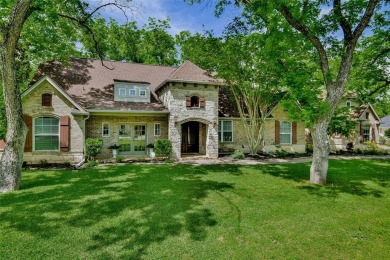 This exceptional residence in Pecan Plantation, is a stone and on Pecan Plantation Country Club in Texas - for sale on GolfHomes.com, golf home, golf lot