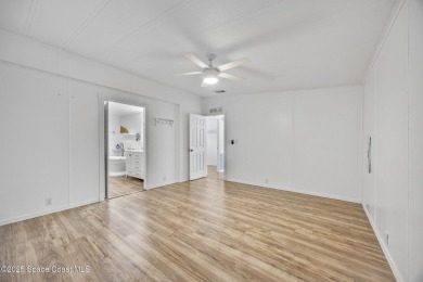 Beautiful updated manufactured home in Barefoot Bay. New roof in on Barefoot Bay Golf Course in Florida - for sale on GolfHomes.com, golf home, golf lot