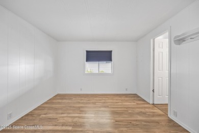 Beautiful updated manufactured home in Barefoot Bay. New roof in on Barefoot Bay Golf Course in Florida - for sale on GolfHomes.com, golf home, golf lot