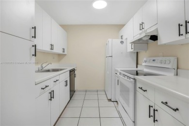Move-in ready first-floor condo in sought-after Miami Lakes on Don Shulas Golf Course and Club in Florida - for sale on GolfHomes.com, golf home, golf lot