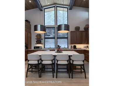 Discover mountain living at its finest at 15465 Tall Timber Rd on Snake River Sporting Club in Wyoming - for sale on GolfHomes.com, golf home, golf lot