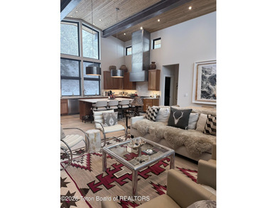 Discover mountain living at its finest at 15465 Tall Timber Rd on Snake River Sporting Club in Wyoming - for sale on GolfHomes.com, golf home, golf lot