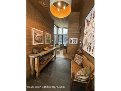 Discover mountain living at its finest at 15465 Tall Timber Rd on Snake River Sporting Club in Wyoming - for sale on GolfHomes.com, golf home, golf lot