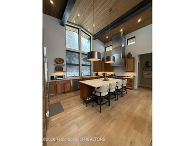 Discover mountain living at its finest at 15465 Tall Timber Rd on Snake River Sporting Club in Wyoming - for sale on GolfHomes.com, golf home, golf lot