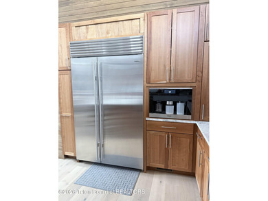 Discover mountain living at its finest at 15465 Tall Timber Rd on Snake River Sporting Club in Wyoming - for sale on GolfHomes.com, golf home, golf lot