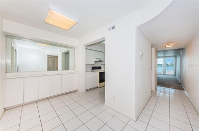 RARELY available 1st floor condo. Overlooking the intracoastal on Isla Del Sol Yacht and Country Club in Florida - for sale on GolfHomes.com, golf home, golf lot