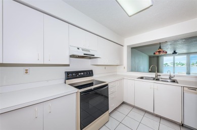 RARELY available 1st floor condo. Overlooking the intracoastal on Isla Del Sol Yacht and Country Club in Florida - for sale on GolfHomes.com, golf home, golf lot