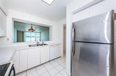 RARELY available 1st floor condo. Overlooking the intracoastal on Isla Del Sol Yacht and Country Club in Florida - for sale on GolfHomes.com, golf home, golf lot