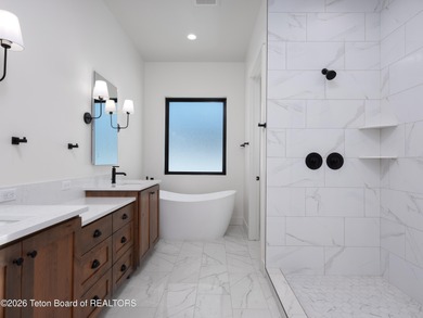 Thoughtfully oriented, this new custom home is designed around on Teton Reserve in Idaho - for sale on GolfHomes.com, golf home, golf lot