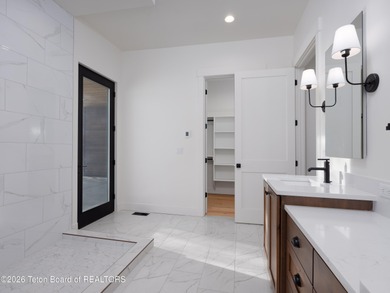 Thoughtfully oriented, this new custom home is designed around on Teton Reserve in Idaho - for sale on GolfHomes.com, golf home, golf lot