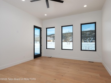 Thoughtfully oriented, this new custom home is designed around on Teton Reserve in Idaho - for sale on GolfHomes.com, golf home, golf lot