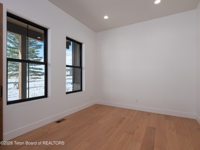 Thoughtfully oriented, this new custom home is designed around on Teton Reserve in Idaho - for sale on GolfHomes.com, golf home, golf lot