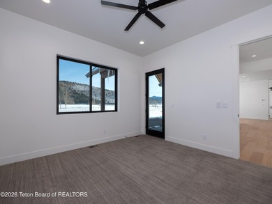 Thoughtfully oriented, this new custom home is designed around on Teton Reserve in Idaho - for sale on GolfHomes.com, golf home, golf lot