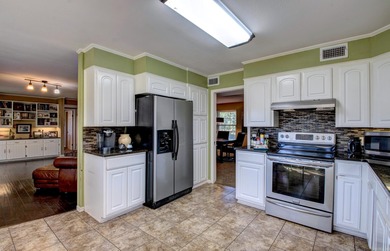 This spacious home in Foxwood offers 3 bedrooms and 3 1/2  baths on Foxwood Golf Club in Arkansas - for sale on GolfHomes.com, golf home, golf lot