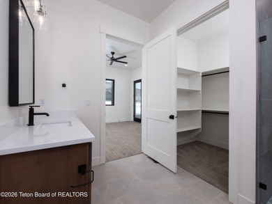 Thoughtfully oriented, this new custom home is designed around on Teton Reserve in Idaho - for sale on GolfHomes.com, golf home, golf lot