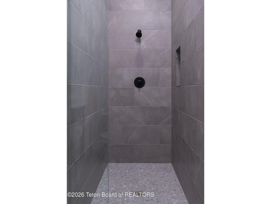 Thoughtfully oriented, this new custom home is designed around on Teton Reserve in Idaho - for sale on GolfHomes.com, golf home, golf lot