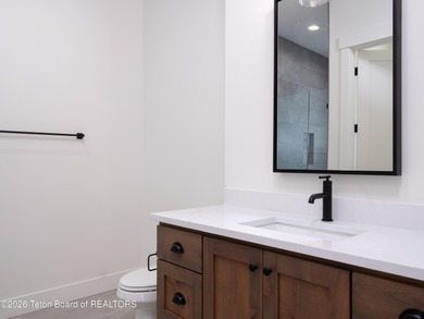 Thoughtfully oriented, this new custom home is designed around on Teton Reserve in Idaho - for sale on GolfHomes.com, golf home, golf lot