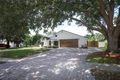 Discover comfort and privacy in this charming and updated on Rio Pinar Golf and Country Club in Florida - for sale on GolfHomes.com, golf home, golf lot