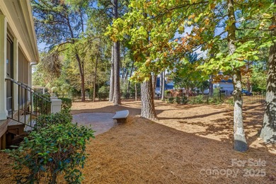 Immaculate home on a quiet street in the coveted Peninsula on The Peninsula Club in North Carolina - for sale on GolfHomes.com, golf home, golf lot