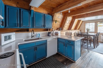 Nestled among a serene canopy of mature trees, this charming on Star Valley RV Golf Course in Wyoming - for sale on GolfHomes.com, golf home, golf lot