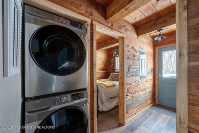 Nestled among a serene canopy of mature trees, this charming on Star Valley RV Golf Course in Wyoming - for sale on GolfHomes.com, golf home, golf lot