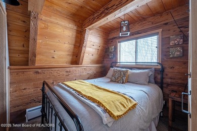 Nestled among a serene canopy of mature trees, this charming on Star Valley RV Golf Course in Wyoming - for sale on GolfHomes.com, golf home, golf lot