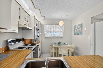 Penthouse views in this 1 BR, 1.5 BA with Den that can be used on Poinciana Golf Club in Florida - for sale on GolfHomes.com, golf home, golf lot
