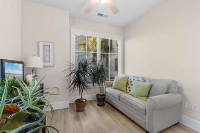 Sunlight pours into this bright, open 3-bedroom, 2-bath end-unit on Barefoot Resort and Golf Club  in South Carolina - for sale on GolfHomes.com, golf home, golf lot